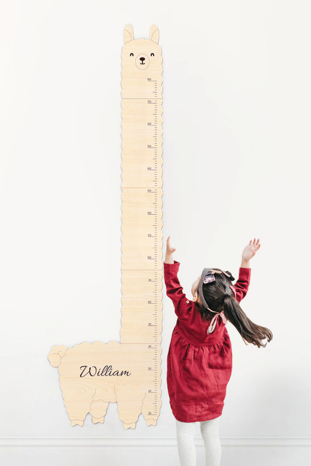 Personalized Wooden Alpaca Baby Growth Chart and a Child